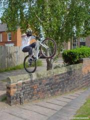 Dave backwheeling to Gap in Stratford